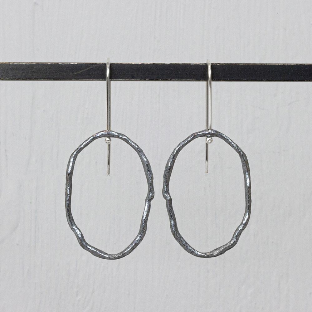 Offener organischer Oxy-Ohrring